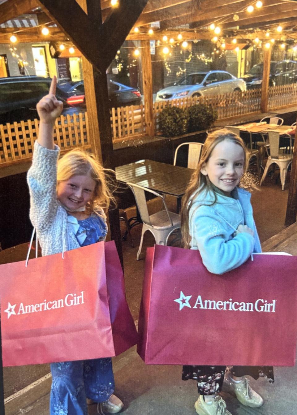 Annie Gotwald, left, and her older sister Samantha Gotwald, right, pose for a photo.