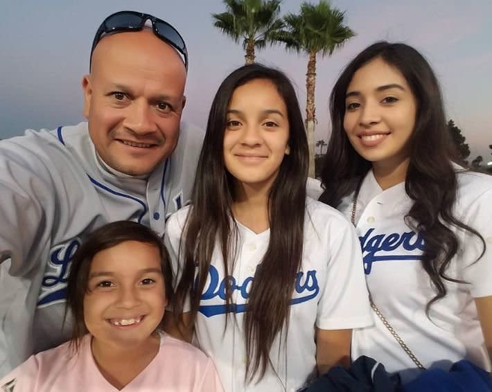 Denise with her father and two older sisters. [Photo: Facebook]