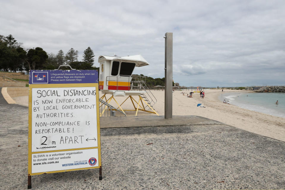 Social distancing signage at Perth's Cottesloe Beach. Source: Getty