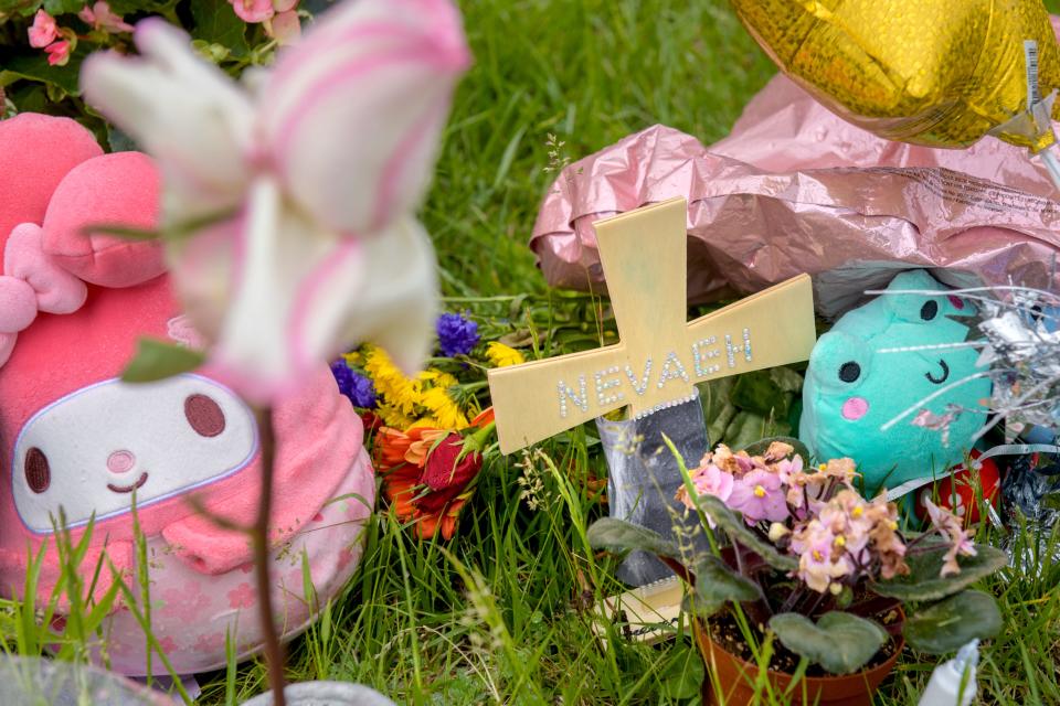 A cross, stuffed animals and flowers make up a makeshift memorial to Dunlap High School senior Nevaeh Mitchell, 18, who was killed in a car crash Sunday, May 5, 2024 in the 8400 block of Orange-Prairie Road in North Peoria.