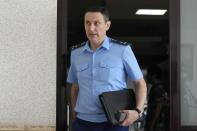 The state prosecutor Mikael Ozdoev walks to a courtroom inside the court in Yekaterinburg, Russia, Thursday, July 18, 2024, during a hearing of Wall Street Journal reporter Evan Gershkovich's suspected spying activities. (AP Photo/Dmitri Lovetsky)