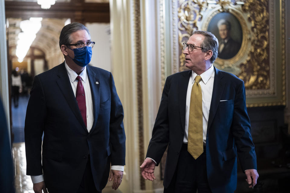 Bruce Castor and Michael van der Veen, lawyers for former President Donald Trump, walk back to their meeting room during a break through the Senate Reception room in the Capitol on the fourth day of the Senate Impeachment trials for former President Donald Trump on Capitol Hill, Friday, Feb 12, 2021 in Washington. (Jabin Botsford/The Washington Post via AP, Pool)