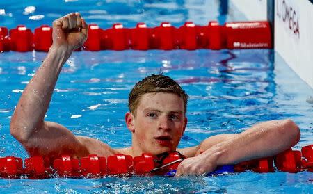 Adam Peaty of Britain reacts after winning the men's 50m breaststroke final at the Aquatics World Championships in Kazan, Russia August 5, 2015. REUTERS/Stefan Wermuth