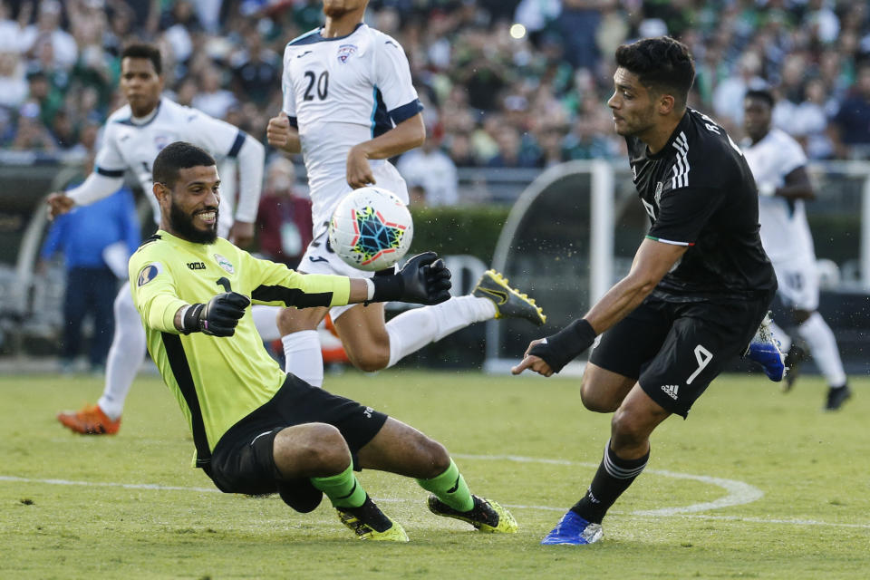 Cuba goalkeeper Sandy Sanchez (1) makes save against Mexico forward Raúl Jimenez (9) during the first half of a CONCACAF Gold Cup soccer match in Pasadena, Calif., Saturday, June 15, 2019. (AP Photo/Ringo H.W. Chiu)