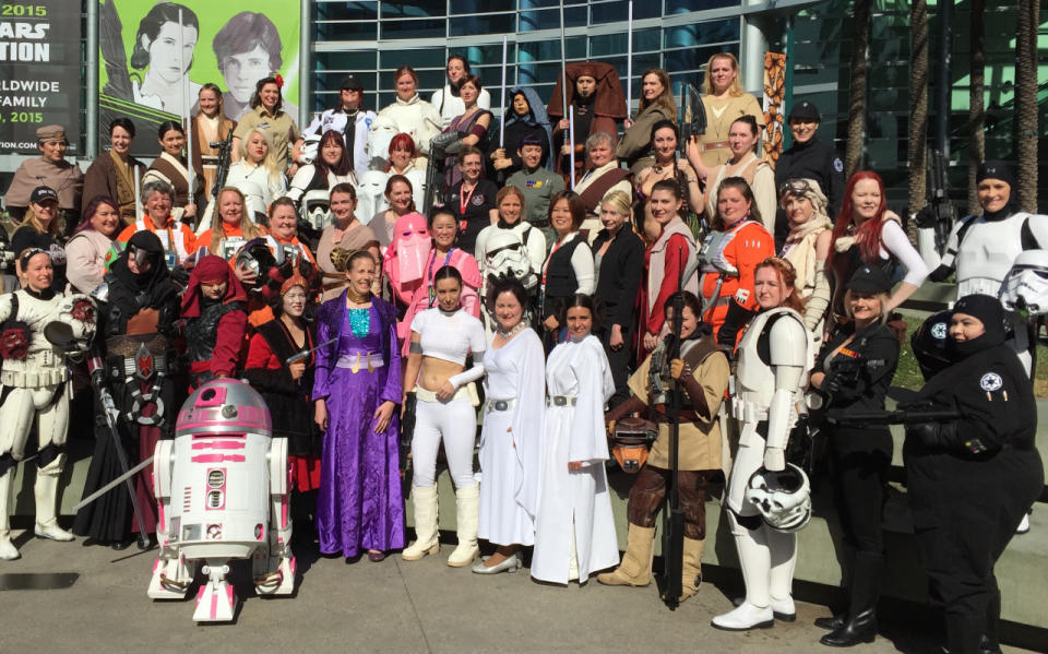 From TIE pilots, to Jedis, to a whole lotta Leias, the ladies of the Celebration take a group shot with the adorable pink astromech R2-KT.