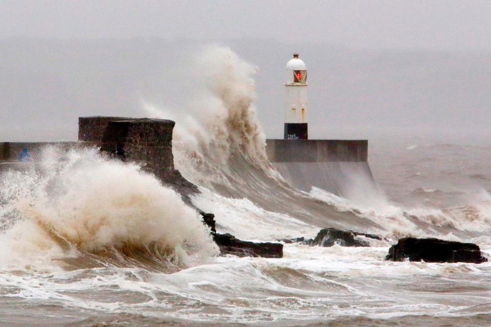 Huge waves crash against the sea wall at Porthcawl, south Wales: AFP via Getty Images