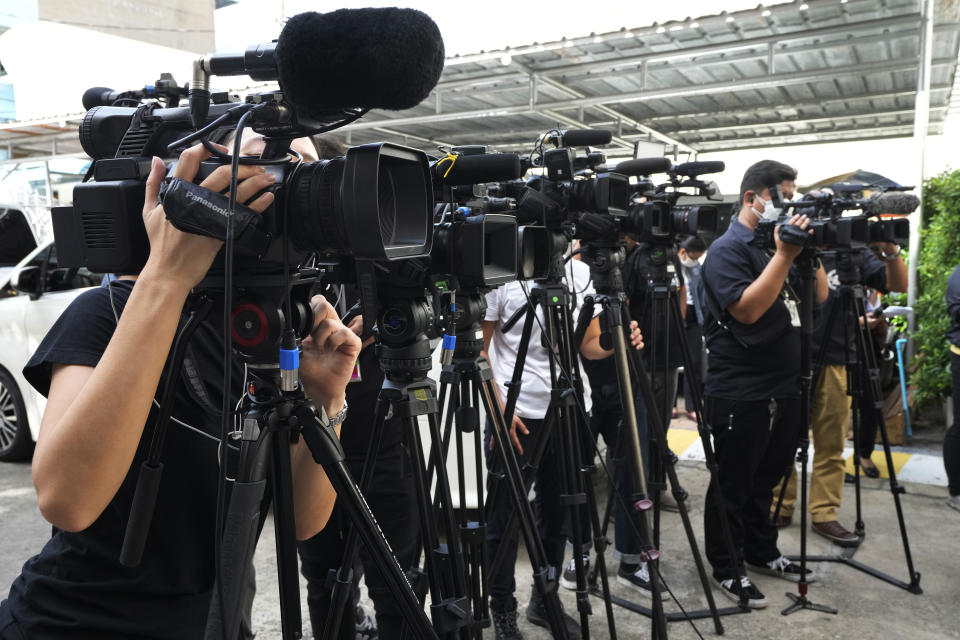 Thai media waiting interview Bangkok Governor Aswin Kwanmuang at the Wat Srisudaram in Bangkok, Thailand, Friday, July 30, 2021. Thailand has implemented regulations that appear to broaden the government's ability to restrict media reports and social media posts about the coronavirus pandemic, raising immediate concerns authorities will seek to stifle criticism rather than just combat false rumors. (AP Photo)