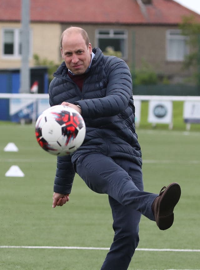 William shows off his football skills during his visit to the Edinburgh club