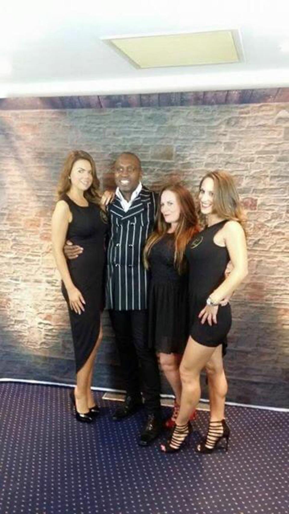 Cheryl with her ring girls and Nigel Benn (Collect/ PA Real Life)