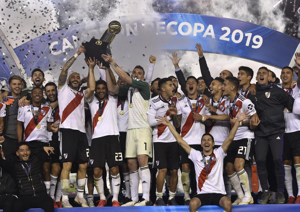 River Plate celebrates with their Recopa trophy after defeating Brazil's Athletico Paranaense 3-0 at the Recopa Sudamericana final soccer match in Buenos Aires, Argentina, Thursday, May 30, 2019. (AP Photo/Gustavo Garello)