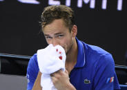 Russia's Daniil Medvedev holds a towel on his nosebleed during his second round singles match against Spain's Pedro Martinez at the Australian Open tennis championship in Melbourne, Australia, Thursday, Jan. 23, 2020. (AP Photo/Andy Brownbill)