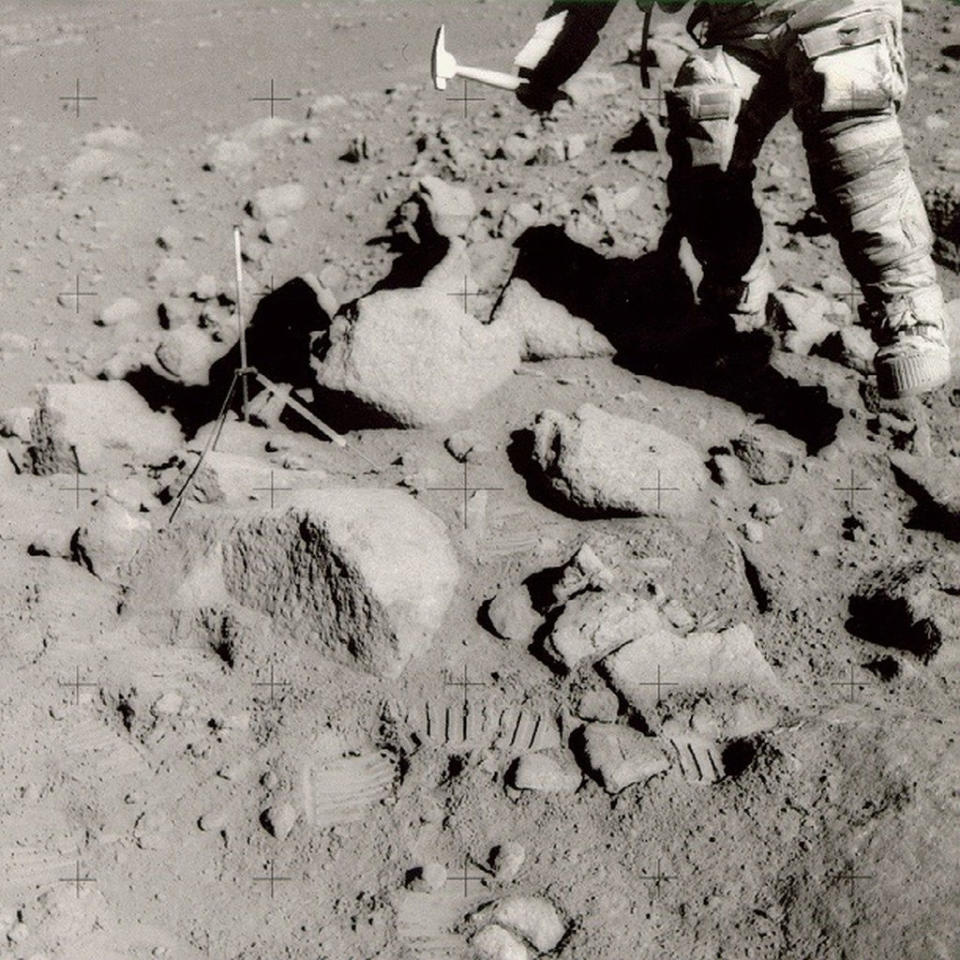 Apollo astronauts used hammers to break small chips off large moon rocks and to drive core tubes into the ground. <cite>NASA/Johnson Space Center</cite>