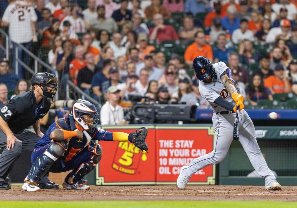 Detroit Tigers catcher Eric Haase (13) hits a two-run RBI double against the Houston Astros in the second inning at Minute Maid Park in Houston on Monday, April 3, 2023.