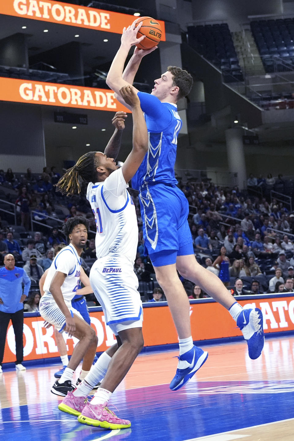 Creighton center Ryan Kalkbrenner, right, goes up for a shot against DePaul forward Da'Sean Nelson during the first half of an NCAA college basketball game in Chicago, Tuesday, Jan. 9, 2024. (AP Photo/Nam Y. Huh)