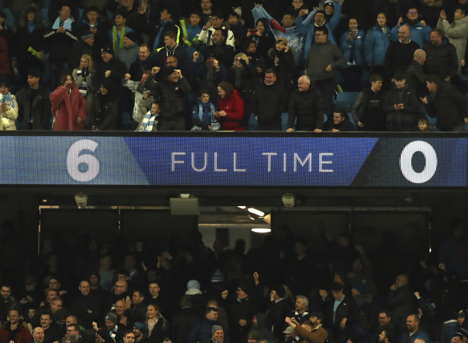 Manchester City fans celebrate at the end of the English Premier League soccer match between Manchester City and Chelsea at Etihad stadium in Manchester, England, Sunday, Feb. 10, 2019. (AP Photo/Jon Super)