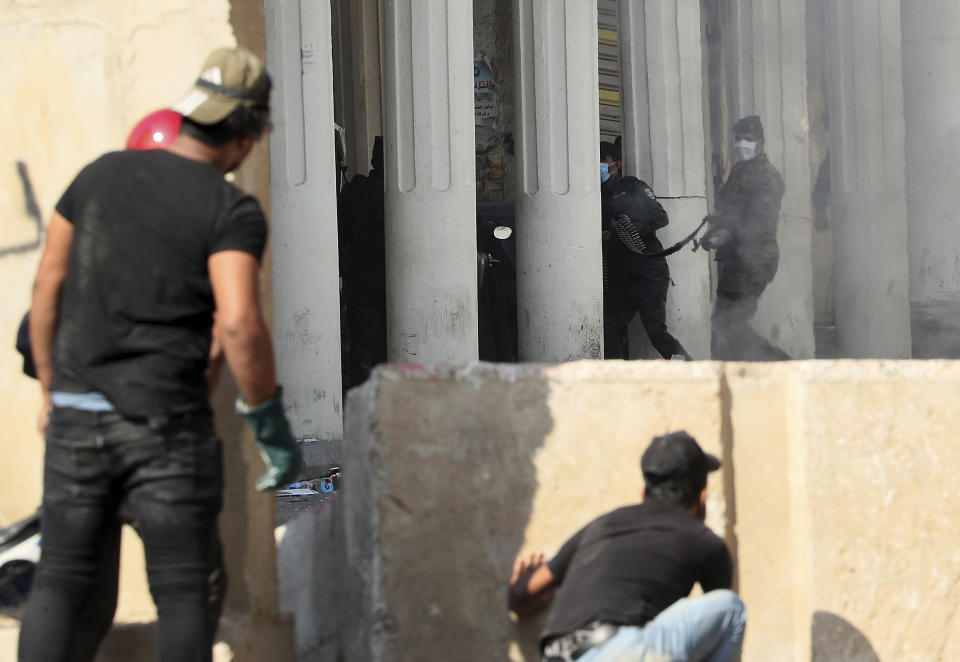 Iraqi security forces try to disperse anti-government protesters during ongoing protests in Baghdad, Iraq, Thursday, Nov. 7, 2019. Tens of thousands of people have taken to the streets in recent weeks in Iraq to protest widespread corruption, a lack of job opportunities and poor basic services, despite Iraq’s vast oil reserves. (AP Photo/Hadi Mizban)