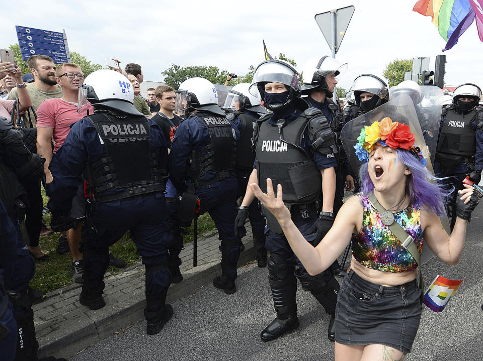 FILE - LGBT activists and their supporters gather for the first-ever pride parade in the central city of Plock, Poland, Saturday Aug. 10, 2019. Despite the war in Ukraine, the country's largest LGBT rights event, KyivPride, is going ahead on Saturday, June 25, 2022. But not on its native streets and not as a celebration of gay pride. It will instead join Warsaw's yearly Equality Parade, using it as a platform to keep international attention focused on the Ukrainian struggle for freedom. (AP Photo/Czarek Sokolowski, File)