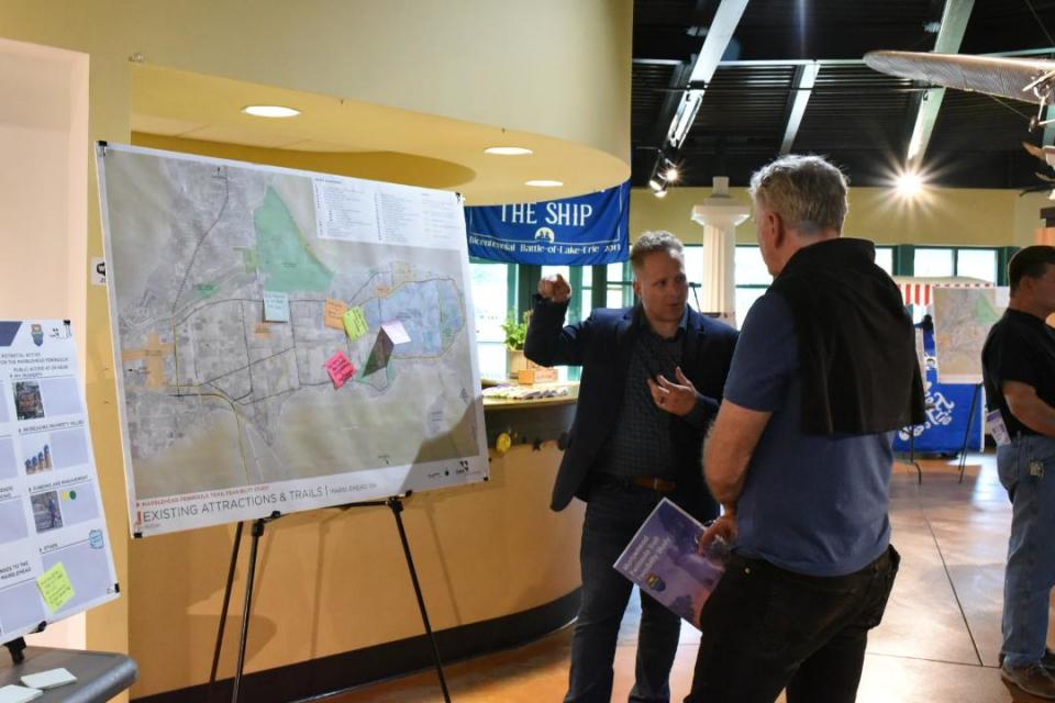 Jeremy Hinte, of OHM Advisors, talks to attendees of a public open house hosted by the Park District of Ottawa County about a possible multi-use trail on the Marblehead Peninsula. People can weigh in on the trail in an online survey on OHM's website until May 3.