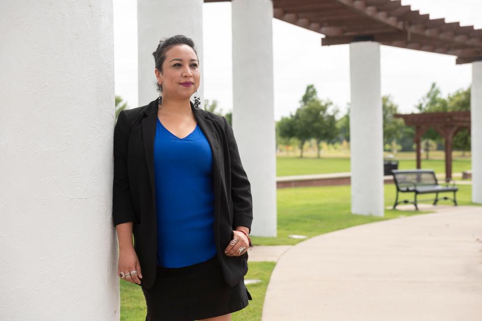 Magaly Licolli, a poultry worker activist, stands in the Orchards Park Recreational Area in Bentonville, Arkansas, 
on Monday, June 29, 2020.