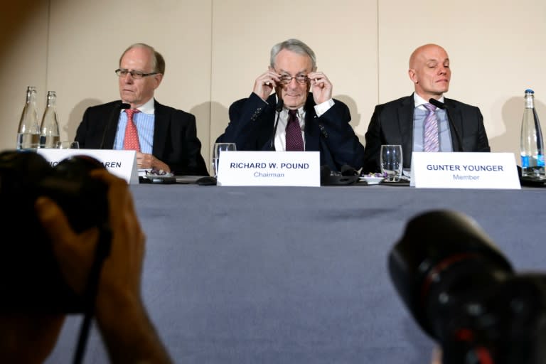 (L-R) Richard McLaren, Dick Pound, and Guenter Younger take part in the presentation before the press of a report on corruption and money-laundering within international athletics on November 9, 2015 in Geneva