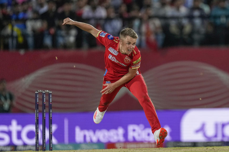 Punjab Kings' Sam Curran bowls a delivery during the Indian Premier League cricket match between Punjab Kings and Rajasthan Royals in Dharamshala, India, Friday, May 19, 2023. (AP Photo /Ashwini Bhatia)