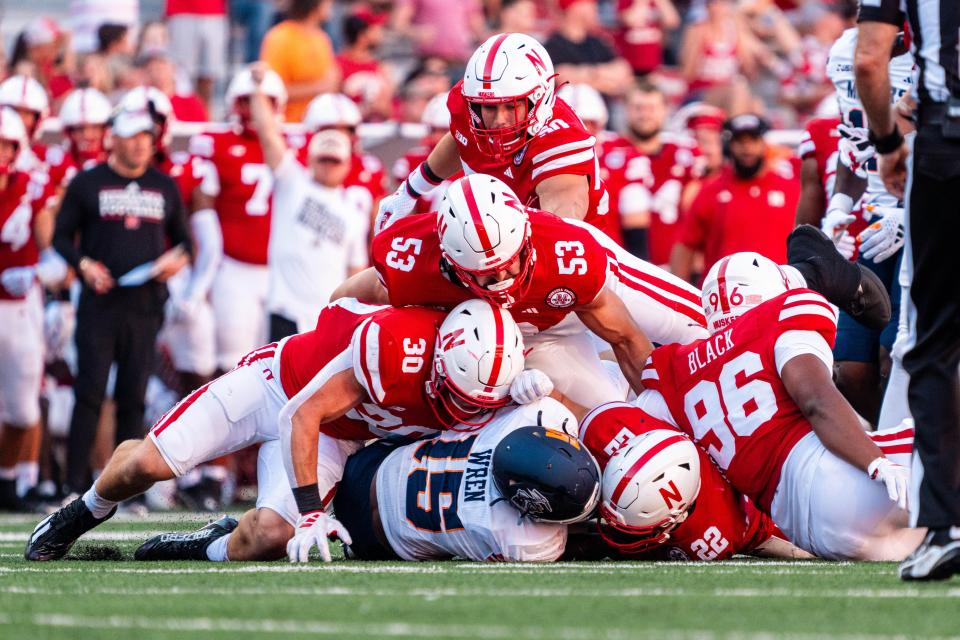 Aug 31, 2024; Lincoln, Nebraska, USA; UTEP Miners running back Corey Wren (15) is tackled by Nebraska Cornhuskers defenders during the fourth quarter at Memorial Stadium. Mandatory Credit: Dylan Widger-USA TODAY Sports