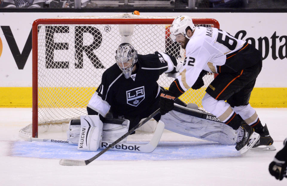 Anaheim Ducks left wing Patrick Maroon, right, tries to get a shot in on Los Angeles Kings goalie Martin Jones during the third period in Game 4 of an NHL hockey second-round Stanley Cup playoff series, Saturday, May 10, 2014, in Los Angeles. The Duck won 2-0. (AP Photo/Mark J. Terrill)