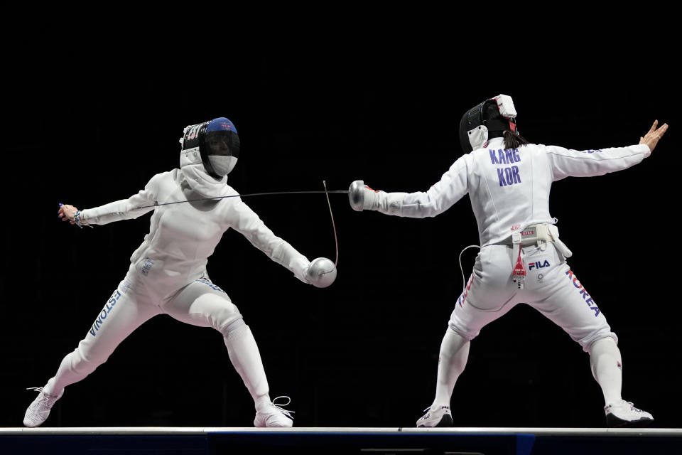 Katrina Lehis of Estonia, left, and Kang Young Mi of South Korea compete in the women's individual Epee team final competition at the 2020 Summer Olympics, Tuesday, July 27, 2021, in Chiba, Japan. (AP Photo/Hassan Ammar)