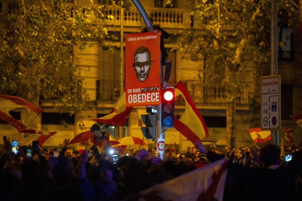 Demonstrators protest against the amnesty, outside the headquarters of Socialist Party in Madrid, Spain, Friday, Nov. 10, 2023. Spain's Socialist Party has struck a deal with a fringe Catalan separatist party to grant an amnesty for people involved in the region's failed secession bid, sparking a protest outside the party's headquarters. (AP Photo/Joan Mateu Parra)