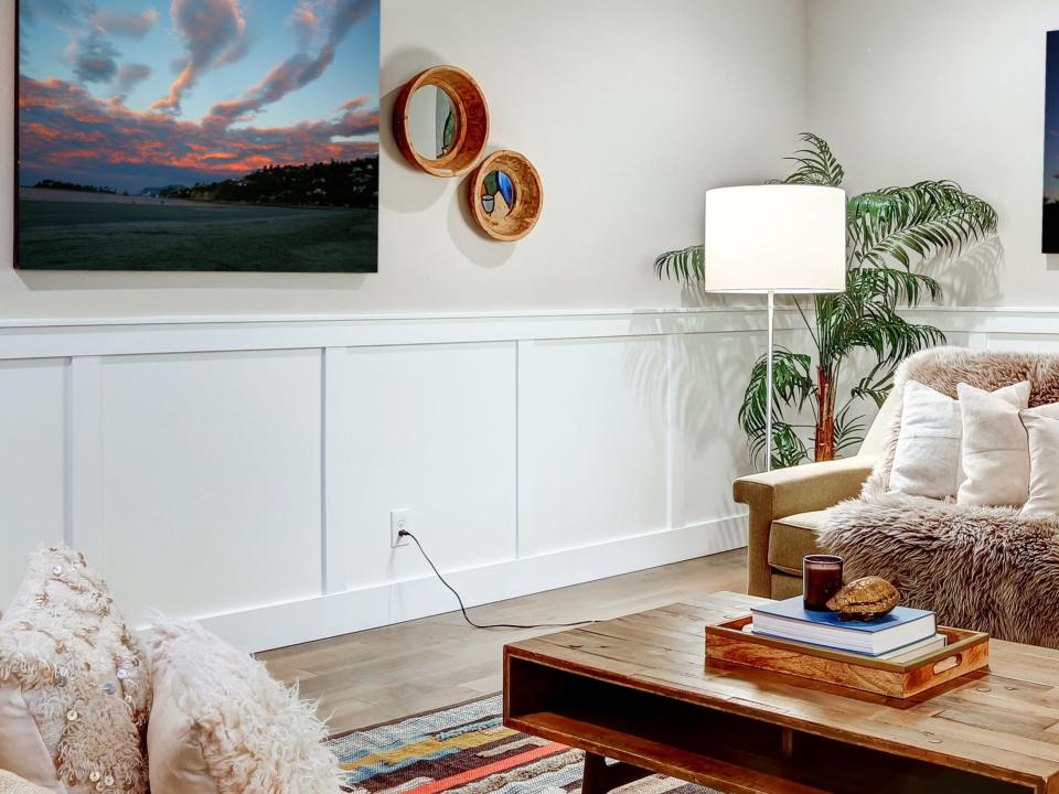 Living room with a board-and-batten design along the lower half of the walls