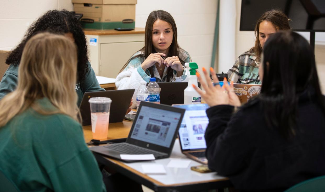 Rylee Curl, center, works with four classmates at William Mason High School to investigate the cold case 2010 murder of Alicia Jackson of Columbus. Four of the five students on her team will study criminal justice when they begin college this fall.