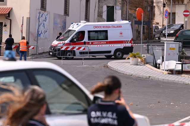 <p>Vincenzo Pepe/Getty</p> Ambulance parked near harbor where search continues after yacht capsized on Monday, Aug. 19, 2024