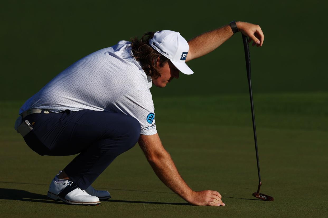 Ohio State golfer Neal Shipley lines up a putt on the second green at the Masters on Friday.