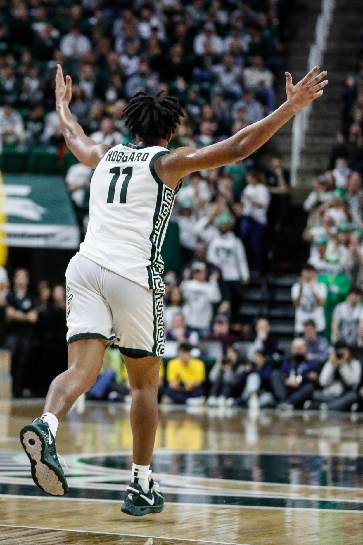 Michigan State guard A.J. Hoggard (11) celebrates his 1,000th career point after scoring against Michigan during the second half against Michigan at Breslin Center in East Lansing on Tuesday, Jan. 30, 2024.