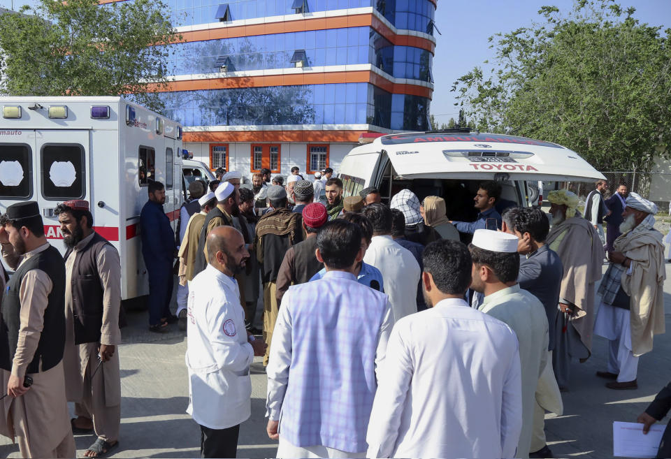 In this handout photo released by the Afghanistan Foreign Ministry, Afghan families receive bodies of their relatives who died while being smuggled into Bulgaria, at the Kabul International Airport in Kabul, Afghanistan, Wednesday, May 24, 2023. The bodies of 18 Afghan migrants who died while being smuggled into Bulgaria were returned to Afghanistan’s capital, Kabul, on Wednesday, a spokesman for the Taliban government's Foreign Ministry said. (Afghanistan Foreign Ministry via AP)