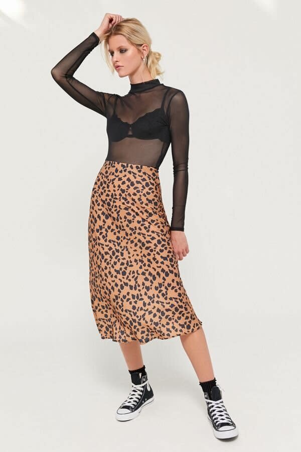 Still don't have a leopard midi skirt? This one is on sale.&nbsp; (Photo: Urban Outfitters)