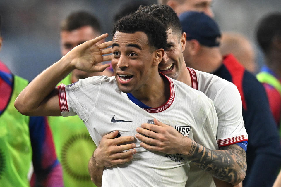 ARLINGTON, TEXAS - MARCH 24: Tyler Adams #4 of the United States celebrates scoring with teammate Christian Pulisic #10 during the first half against Mexico in the Concacaf Nations League Final at AT&T Stadium on March 24, 2024 in Arlington, Texas. (Photo by Stephen Nadler/ISI Photos/USSF/Getty Images for USSF)