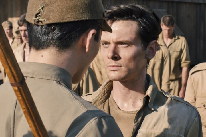 A solider faces a man in Unbroken.