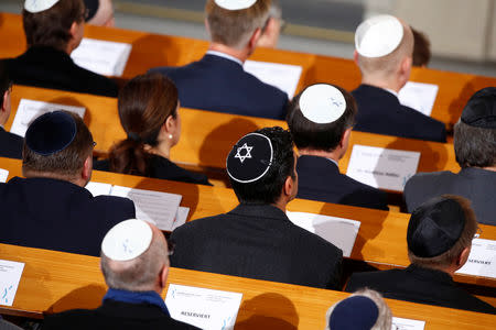 People attend a ceremony to mark the 80th anniversary of Kristallnacht, also known as the Night of Broken Glass, at Rykestrasse Synagogue, in Berlin, Germany, November 9, 2018. REUTERS/Axel Schmidt
