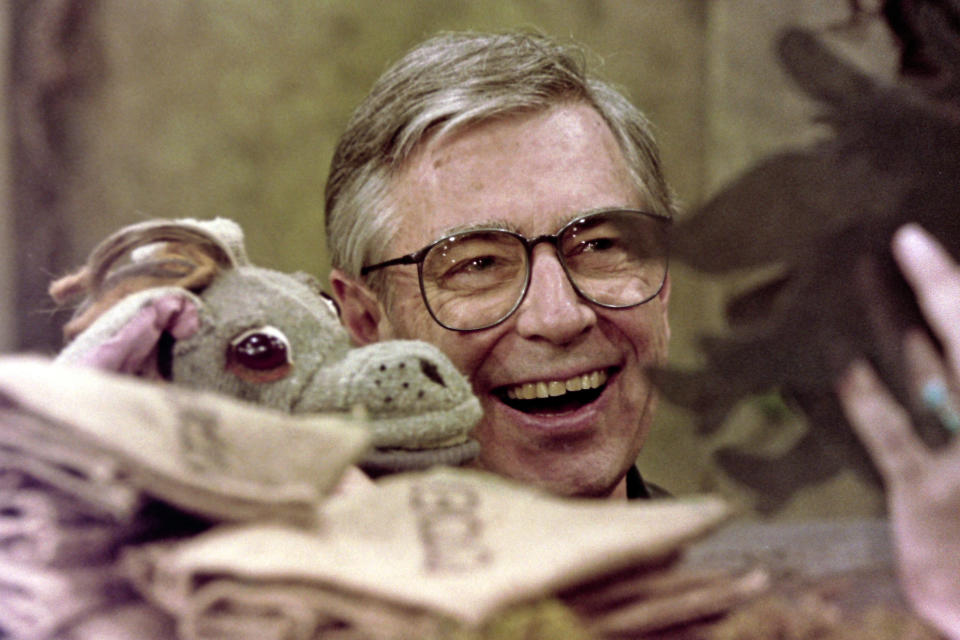 Fred Rogers works with Donkey Hodie, one of the puppets featured on his children's television program, "Mister Rogers' Neighborhood," in Pittsburgh on June 27, 1993. (AP Photo/Gene J. Puskar)