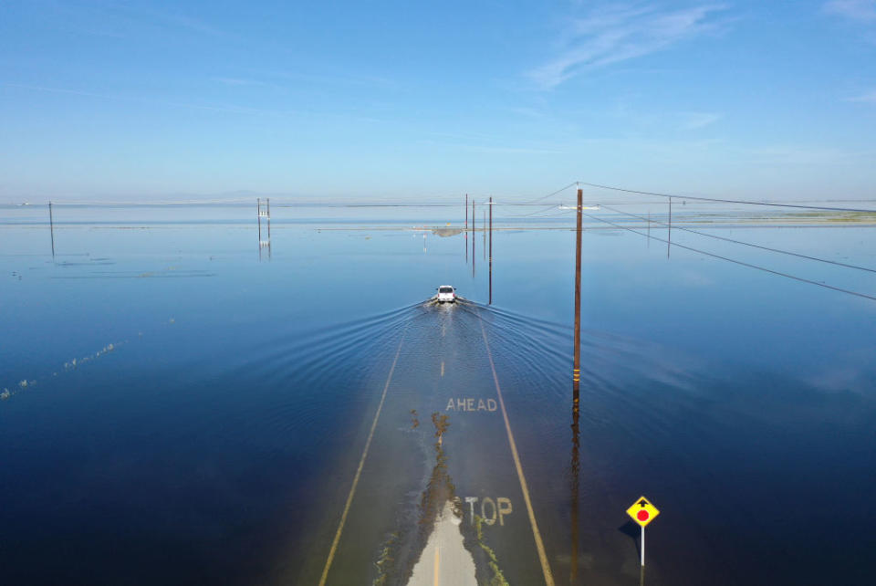 a car driving through a flood