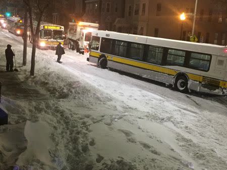 Buses on a road covered in snow in Boston, Massachusetts, U.S. January 4, 2018 in this photo obtained from social media. Karen Lyons Clauson/via REUTERS