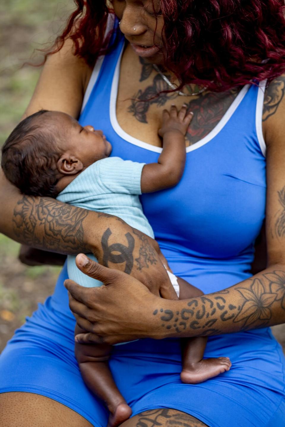 Mother holds her son.