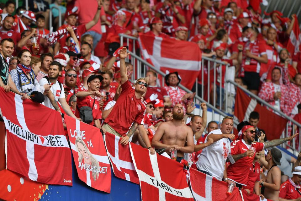 Denmark fans are seen behind their flags before kick off of the Russia 2018 World Cup Group C football match between Denmark and Australia at the Samara Arena in Samara on June 21, 2018. (Getty Images)