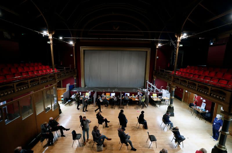 Patients wait to receive a vaccination at the Hartlepool Town Hall Theatre vaccination centre, as the spread of the coronavirus disease (COVID-19) continues in Hartlepool