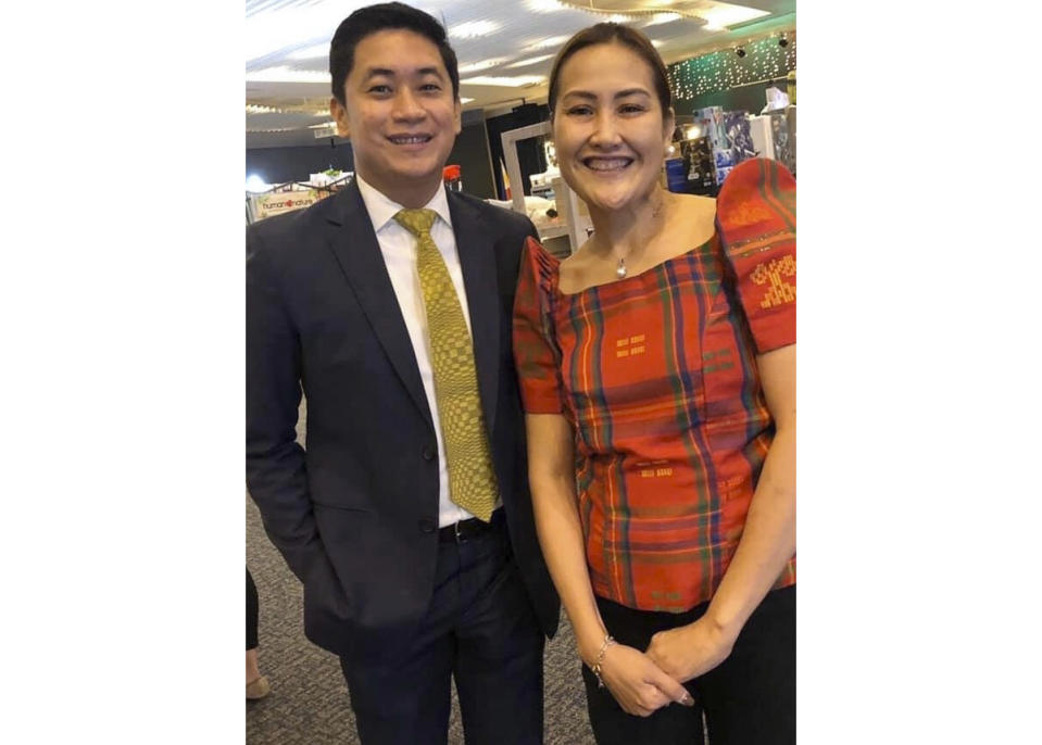 In this late February 2020, photo, Carlo Navarro poses with his wife Evie Navarro for a family photo during a trip to Tokyo. Days after he was cleared and discharged from hospital, Carlo Navarro shared his COVID-19 experience on a Facebook public post. (Carlo Navarro via AP)