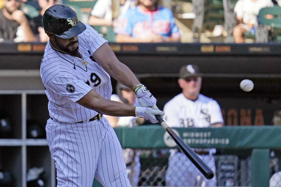 Chicago White Sox's Jose Abreu hits a sacrifice fly during the seventh inning of a baseball game against the Los Angeles Angels in Chicago, Thursday, Sept. 16, 2021. (AP Photo/Nam Y. Huh)