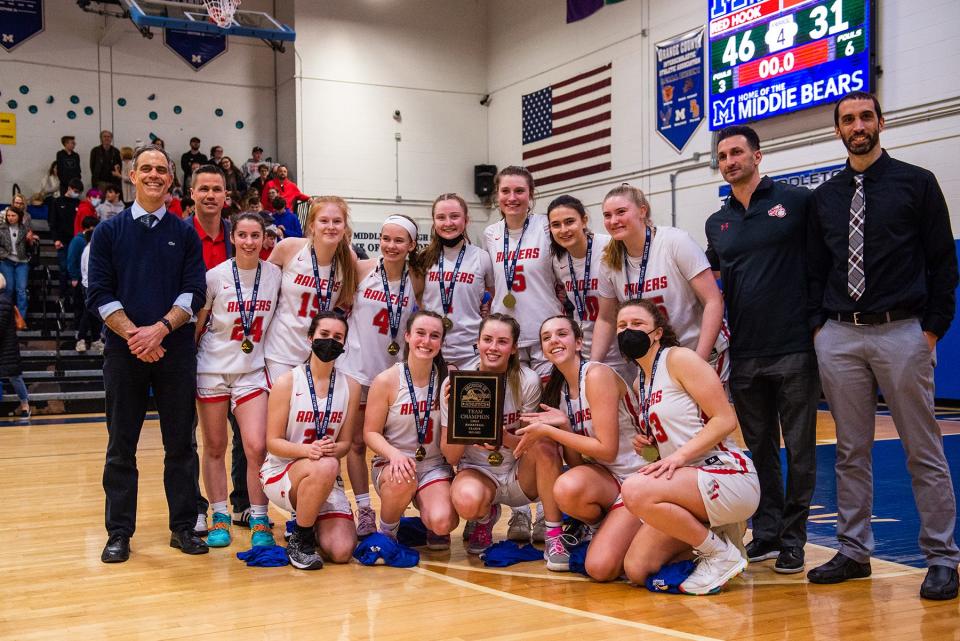 Red Hook poses for a team picture with the Section 9 Class B championship plaque.