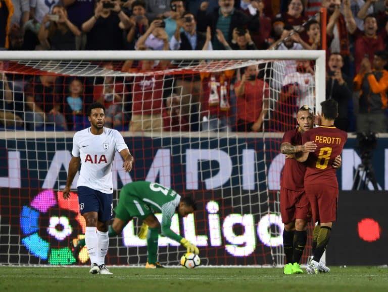 Radja Nainggolan and Diego Perotti (R) of AS Roma celebrate after scoring a goal against Tottenham Hotspur during their International Champions Cup (ICC) match, at Red Bull Arena in Harrison, New Jersey, on July 25, 2017