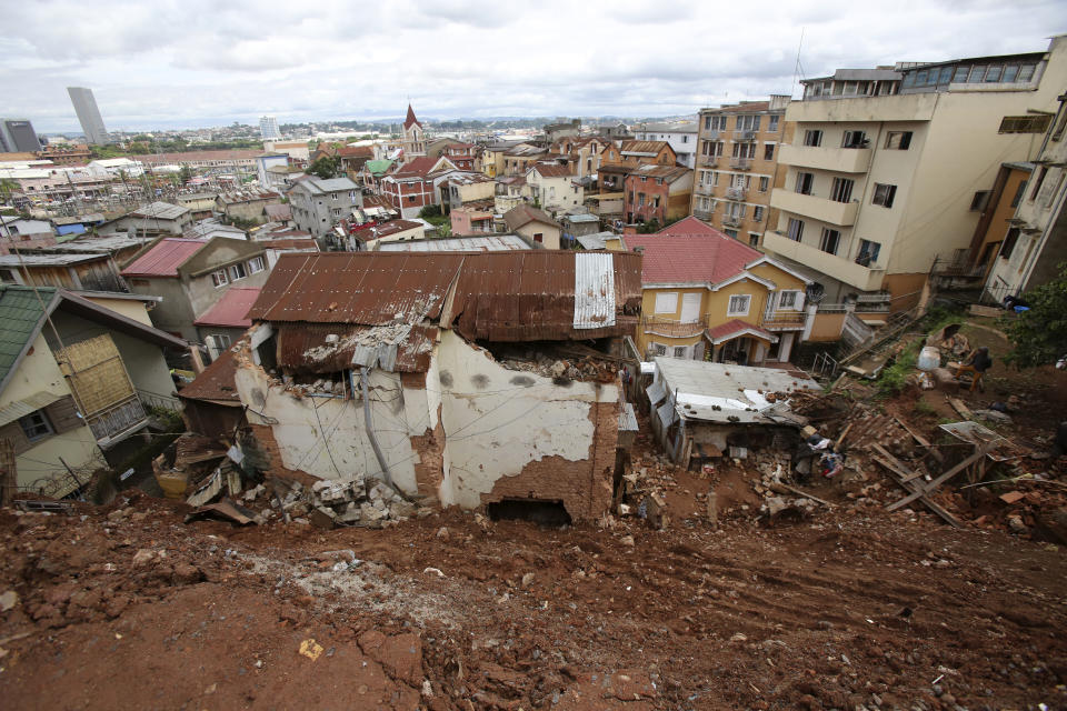 A destroyed house is covered by mud from a landslide caused by tropical storm Ana in Antananarivo, Madagascar, Wednesday, Jan. 26, 2022. With heavy rains continuing, rivers in Antananarivo are rising and officials are urging residents to leave low-lying areas of the capital city and surrounding areas. (AP Photo/Alexander Joe)